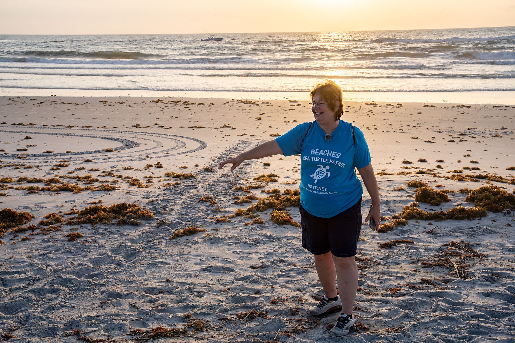 Mary Mills traces a fresh sea turtle crawl at first light