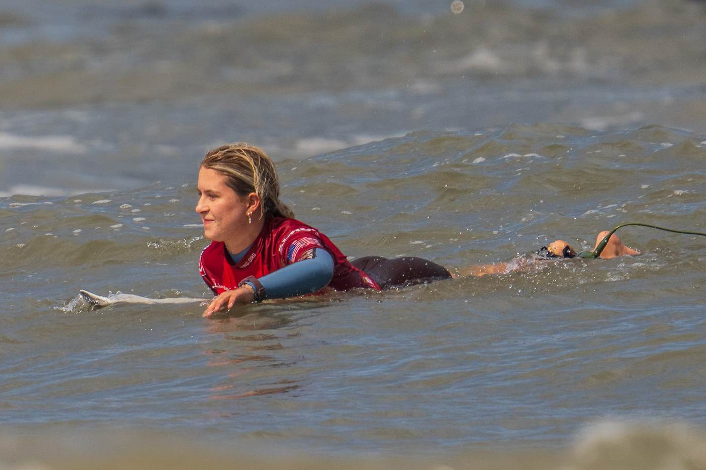 Lanea Mons paddling back out, First Coast
