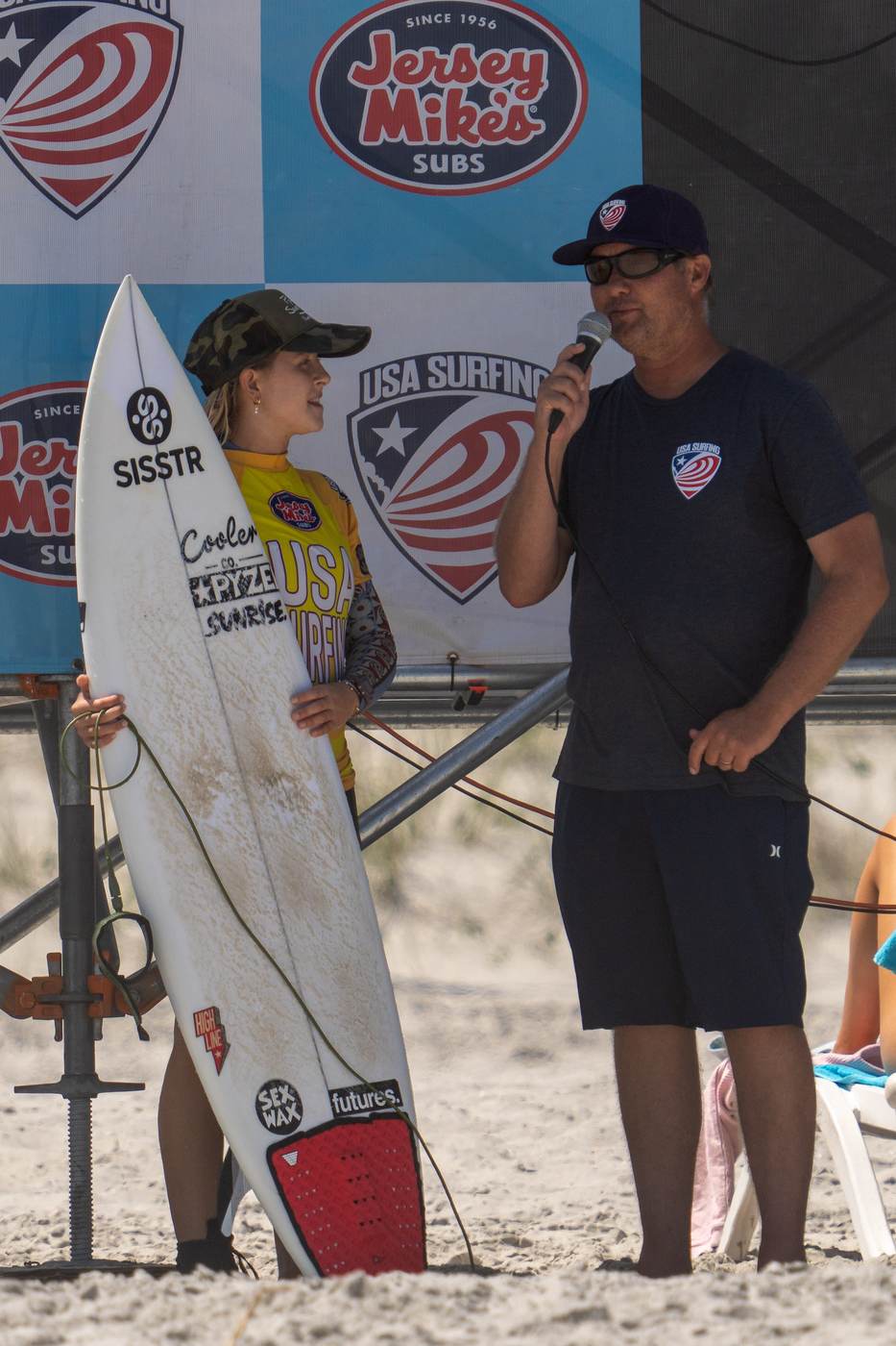 Young surf competitor interviewed on the beach after a heat