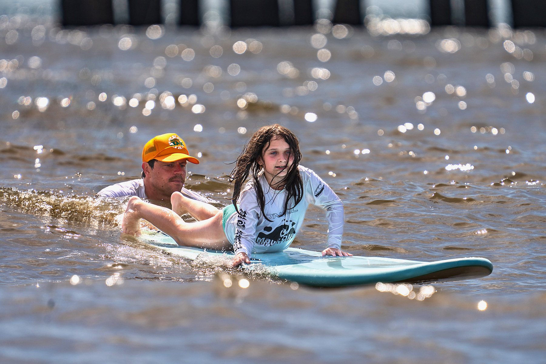 Paddling out. The volunteer stays within arm's reach the entire way.