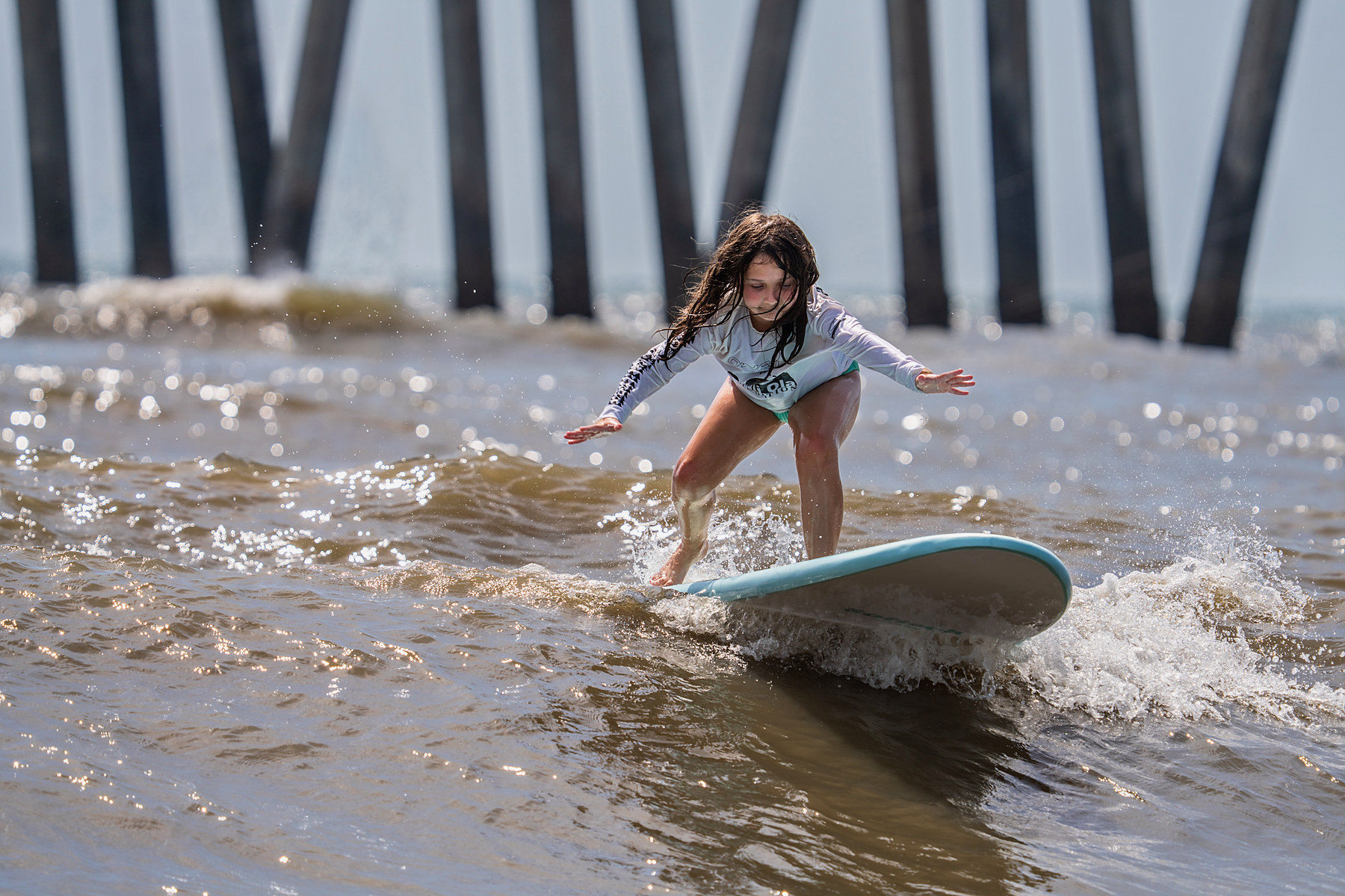 Under the pier, on her feet, unassisted.