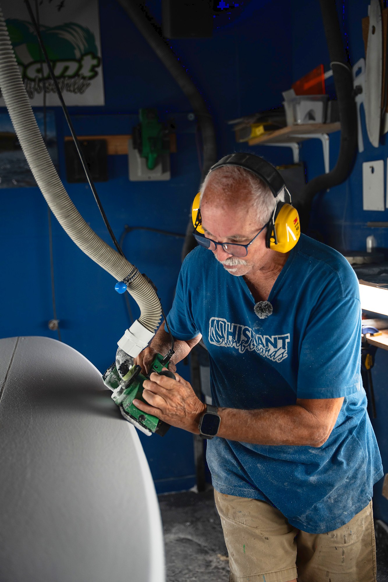 Mike Whisnant shaping a surfboard by hand in his Atlantic Beach bay